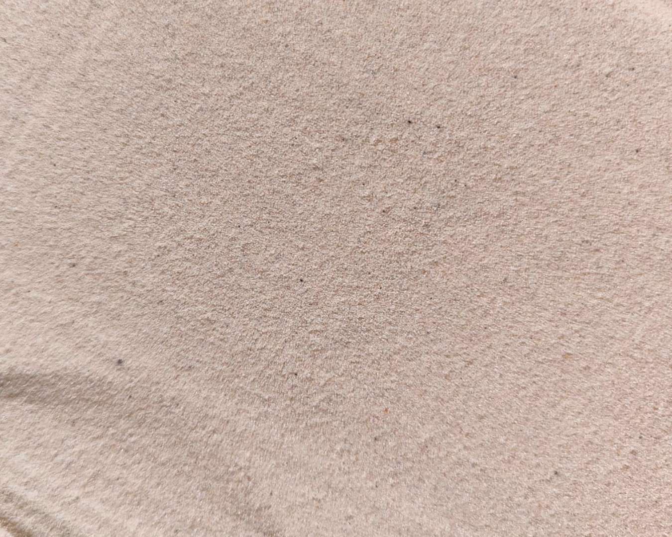 Textura de areia rosada vista de perto